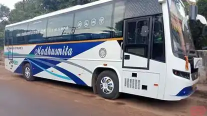 MADHUSMITA TOURS & TRAVELS Bus-Side Image